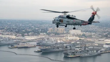 An_MH-60R_Sea_Hawk_helicopter_flies_over_San_Diego._24546100368-jpg-webp.webp