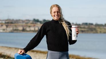 Ellie-Aldridge-with-board-and-bottle.jpg