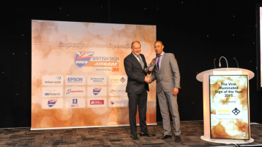 Mark Bartlett, Managing Director of Signbox, accepts BSGA Award for 'Illuminated Sign of the Year'.