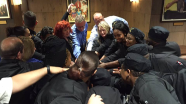 Assistant General Manager Tammy Turner huddles the staff minutes before opening to give them a pep-talk.