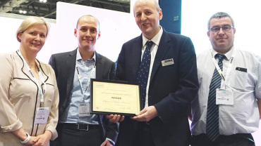 Award presentation – Lord Rupert Redesdale, Chairman of the Energy Managers Association. From Aspire Defence Services Limited (left to right) –  Debbie Bennett,  Mitchel Maynard and David Cottage.