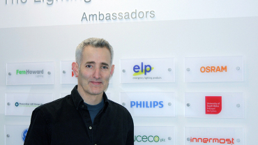 Russell Cameron, sales director and co-founder of Innermost, in front of the Wall of Ambassadors.