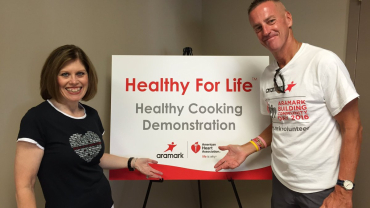 Nancy Brown, CEO of the American Heart Association (AHA) with Aramark Corporation's CEO, Eric Foss.