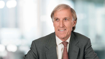 Sir Crispin Davis, OBE.