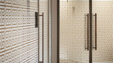 Greek motif manifestations on office glazed partitions at Alpha Bank's London office.
