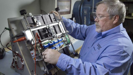 Technician assembling an iBOT robotic vehicle.