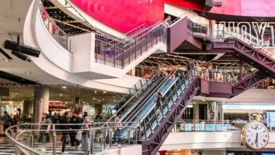 people walking inside building with escalator